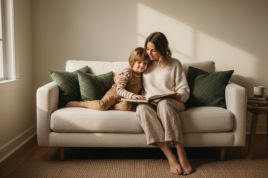 Mother and young child sitting together in calm morning light, depicting the daily moments of presence and connection that build secure attachment in children ages 3 to 10.