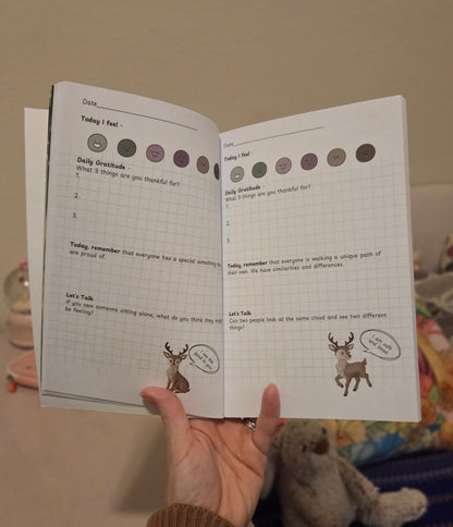 Open page of The Pebble Path journal showing guided prompts for processing big feelings.
