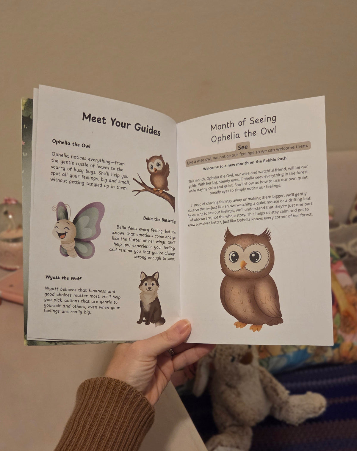 Play therapy kit featuring emotion cards and interactive prompts spread out on a wooden table.